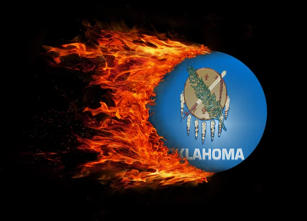 US state flag with a trail of fire - Oklahoma — Stock Photo, Image