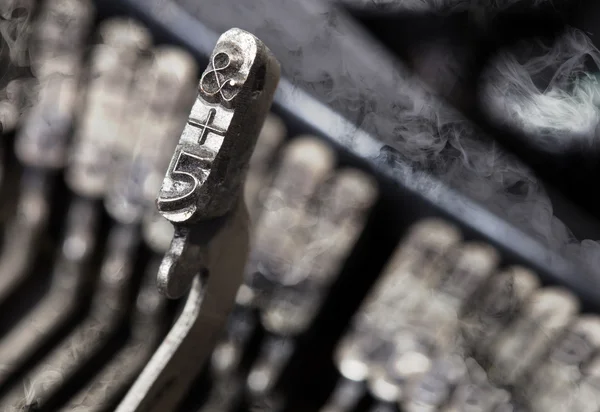 5 and ampersand hammer - old manual typewriter - mystery smoke — Stock Photo, Image