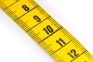 Yellow measuring tape isolated - selective focus