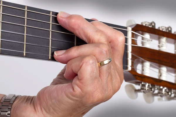 Old hand and guitar isolated — Stock Photo, Image