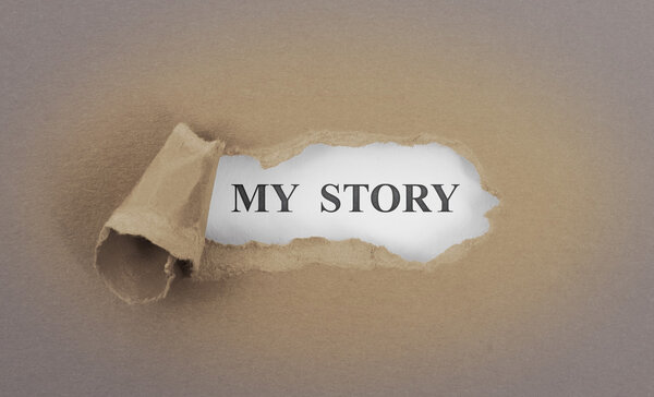 Text appearing behind torn brown envelop