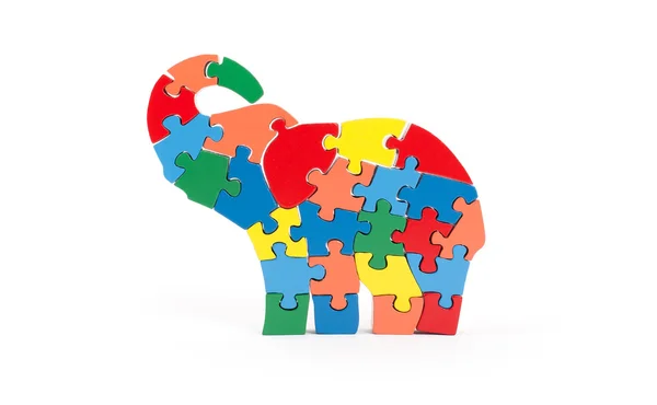 Colorful puzzle pieces in elephant shape — Stock Photo, Image