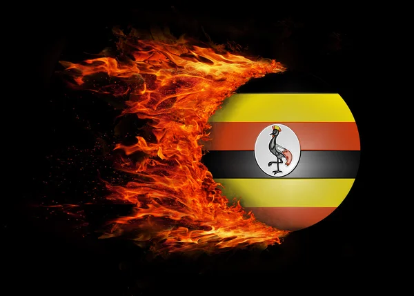 Flagge mit einer Spur des Feuers - Uganda — Stockfoto