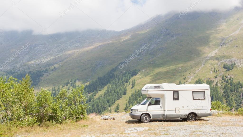 Camper van parked high in the mountains