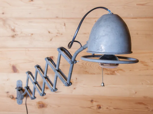 Old electric lamp, harmonica, on a wooden wall, Switzerland — Stock Photo, Image