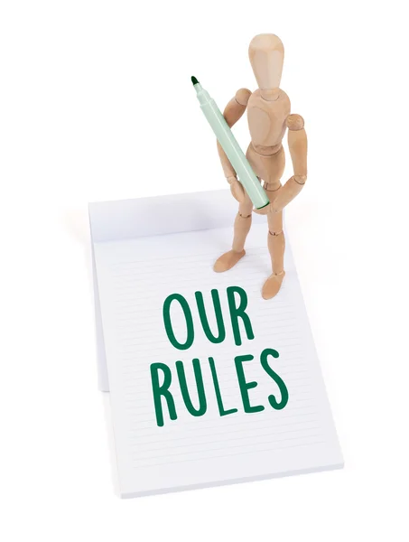 Wooden mannequin writing - Our rules — Stock Photo, Image