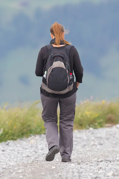 Hiker, young woman with backpack — Stock Photo, Image