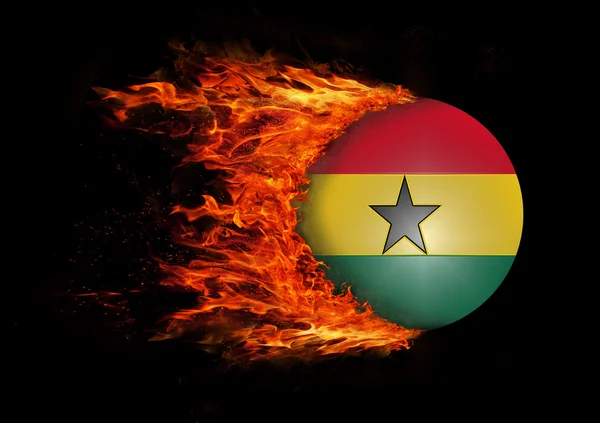 Drapeau avec une traînée de feu - Ghana — Photo