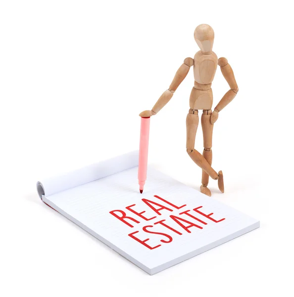 Wooden mannequin writing - Real estate — Stock Photo, Image