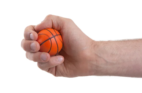 Изолированная рука с мини-баскетбольным мячом — стоковое фото