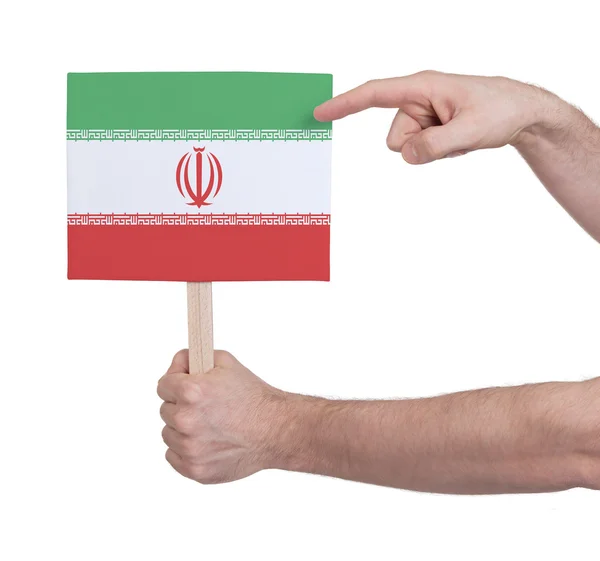 Mano sosteniendo una tarjeta pequeña - Bandera de Irán —  Fotos de Stock