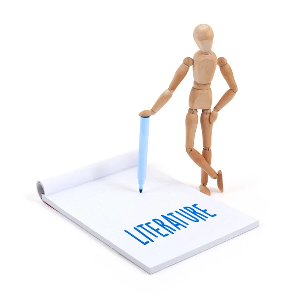 Wooden mannequin writing - Literature — Stock Photo, Image