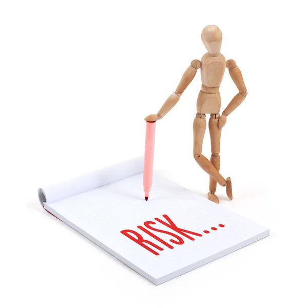 Wooden mannequin writing - Risk — Stock Photo, Image