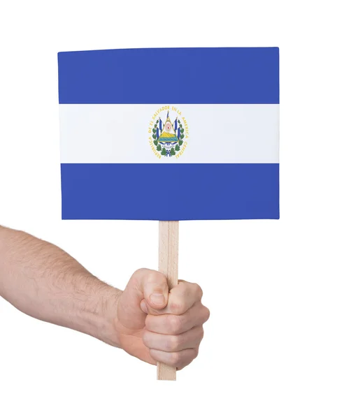 Hand met kleine kaartje - vlag van El Salvador — Stockfoto