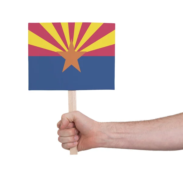 Hand holding small card - Flag of Arizona — Stock Photo, Image