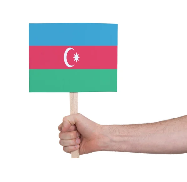 Mão segurando cartão pequeno - Bandeira do Azerbaijão — Fotografia de Stock