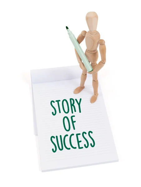 Wooden mannequin writing - Story of success — Stock Photo, Image