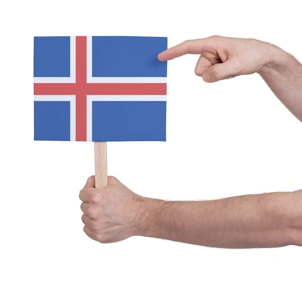 Mano con tarjeta pequeña - Bandera de Islandia — Foto de Stock