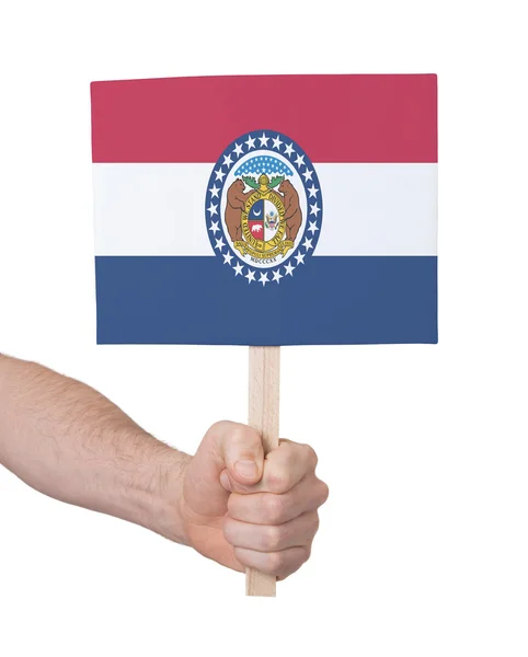 Mano che tiene piccola carta - Bandiera del Missouri — Foto Stock