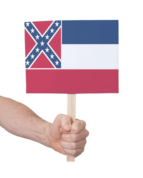 Hand som håller litet kort - flagga i Mississippi — Stockfoto