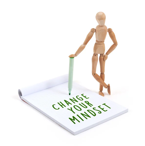 Wooden mannequin writing - Change your mindset — Stock Photo, Image