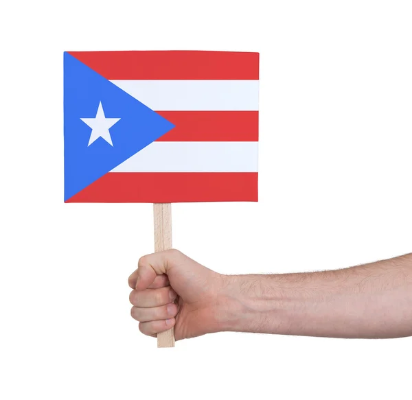 Mão segurando cartão pequeno - Bandeira de Porto Rico — Fotografia de Stock