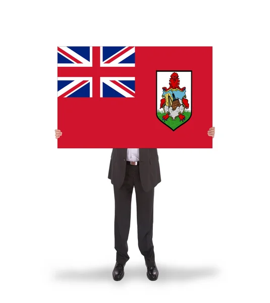 Lächelnder Geschäftsmann mit großer Karte, Flagge aus Bermuda — Stockfoto