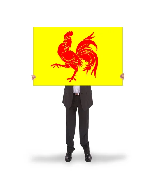 Smiling businessman holding a big card, flag of Wallonia — Stock Photo, Image
