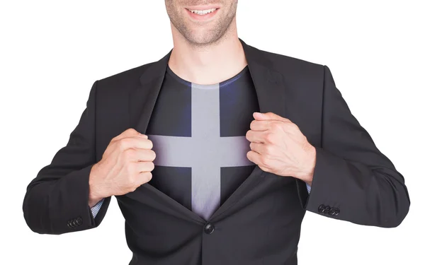 Бизнесмен открывает костюм, чтобы показать рубашку с флагом — стоковое фото