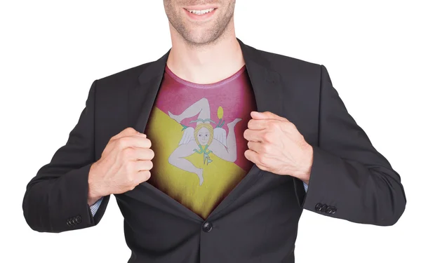 Businessman opening suit to reveal shirt with flag — Stock Photo, Image