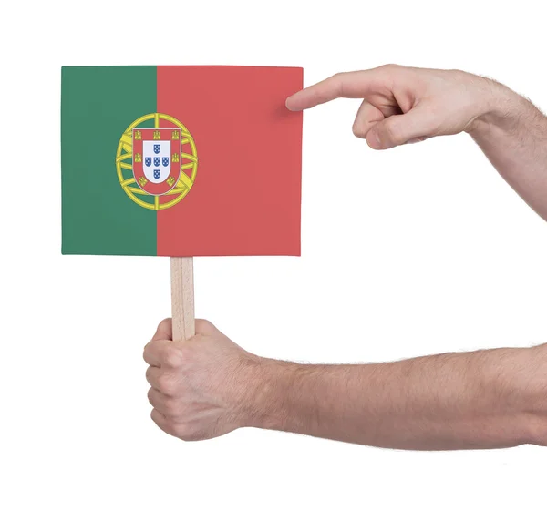 Hand hält kleine Karte - Flagge Portugals — Stockfoto