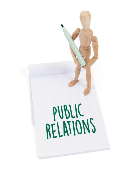 Wooden mannequin writing - Public relations — Stock Photo, Image