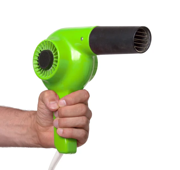 Old green hairdryer in hand — Stock Photo, Image