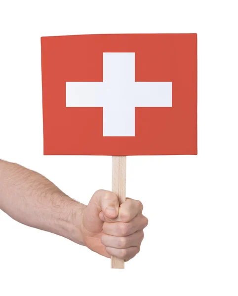 Mano con tarjeta pequeña - Bandera de Suiza —  Fotos de Stock