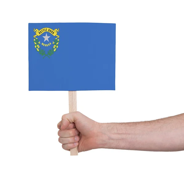 Hand holding small card - Flag of Nevada — Stock Photo, Image