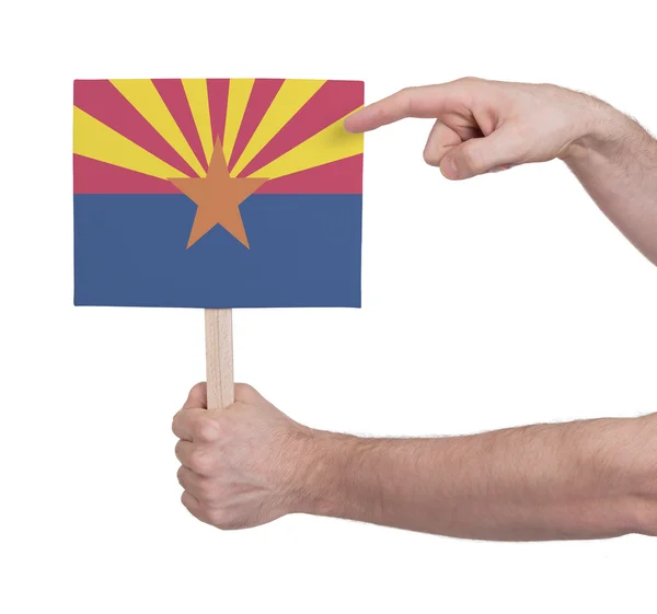 Mano sosteniendo una tarjeta pequeña - Bandera de Arizona —  Fotos de Stock