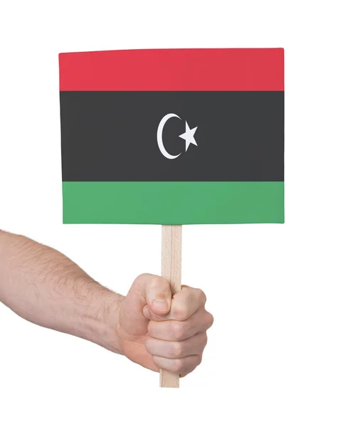 Hand holding small card - Flag of Libya — Stock Photo, Image