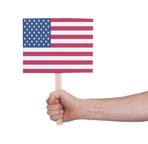 Ruka držící malé karty - vlajka Usa — Stock fotografie