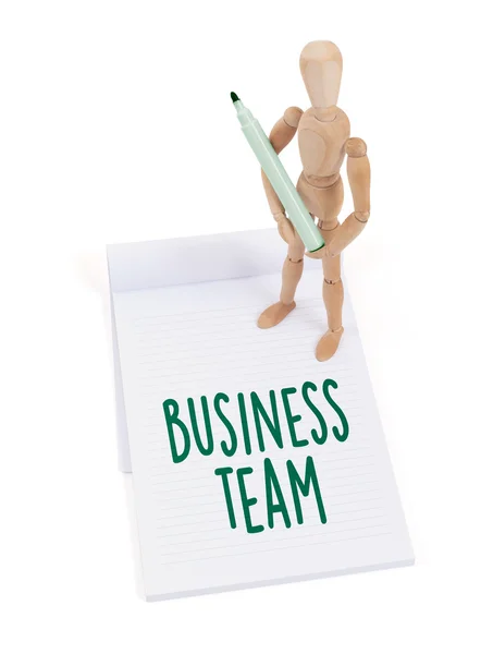 Wooden mannequin writing - Business team — Stock Photo, Image