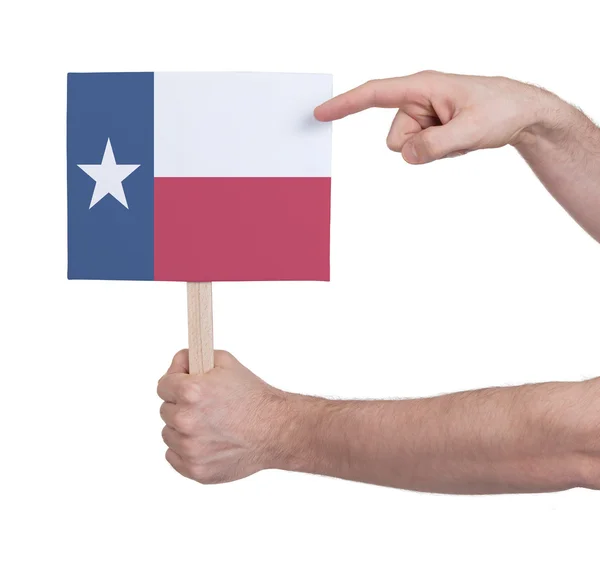 Mão segurando cartão pequeno - Bandeira do Texas — Fotografia de Stock