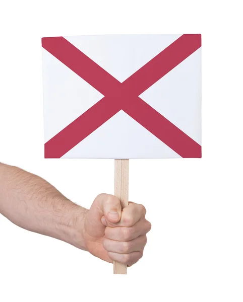 Hand holding small card - Flag of Alabama — Stock Photo, Image