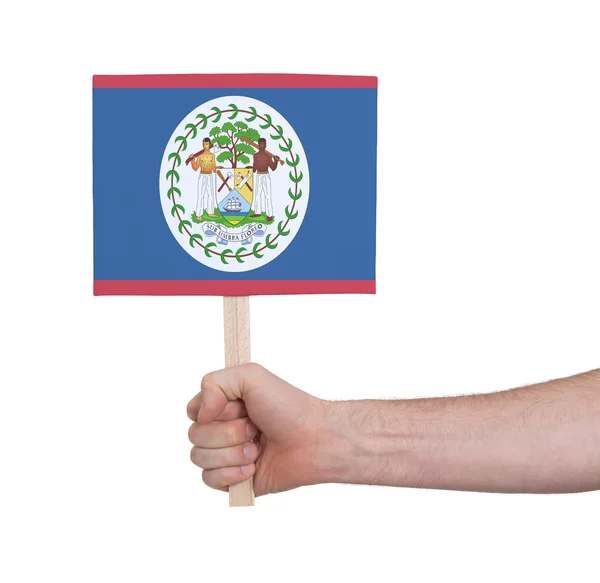 Mano sosteniendo una tarjeta pequeña - Bandera de Belice — Foto de Stock