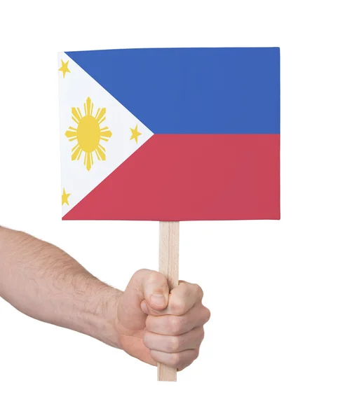 Mano che tiene la piccola carta - Bandiera delle Filippine — Foto Stock