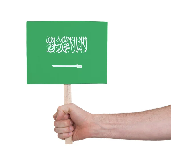 Hand met kleine kaartje - vlag van Saoedi-Arabië — Stockfoto