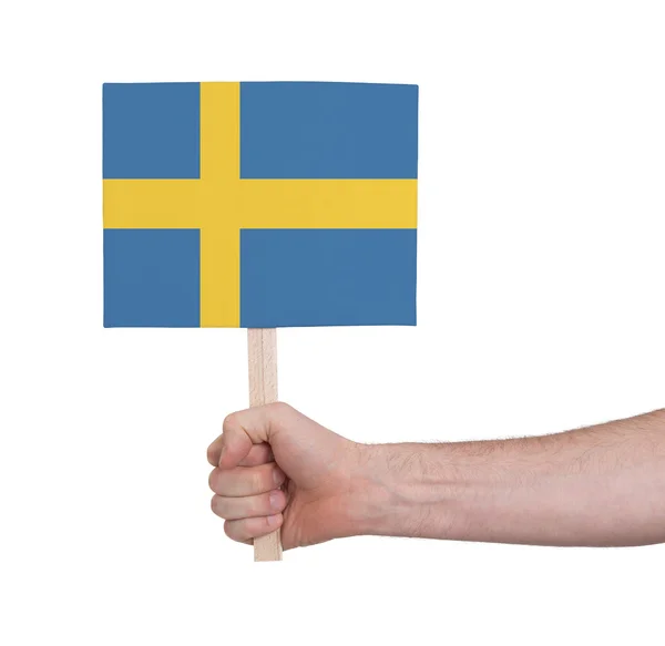 Hand holding small card - Flag of Sweden — Stock Photo, Image