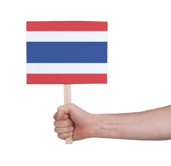 Ruka drží malé karty - vlajkou Thajsko — Stock fotografie