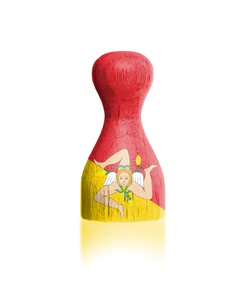 Wooden pawn with a painting of a flag — Stock Photo, Image