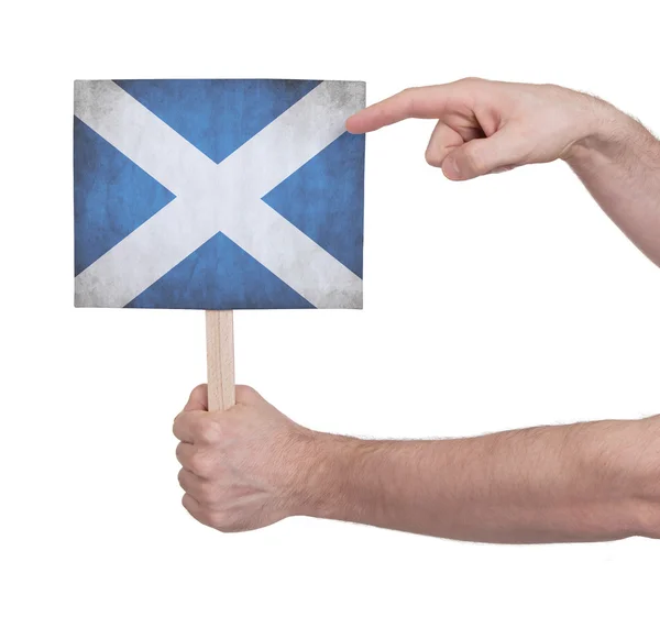 Ruka drží malé karty - vlajka Scotland — Stock fotografie