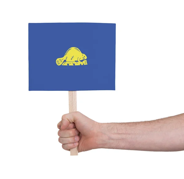 Hand holding small card - Flag of Oregon — Stock Photo, Image