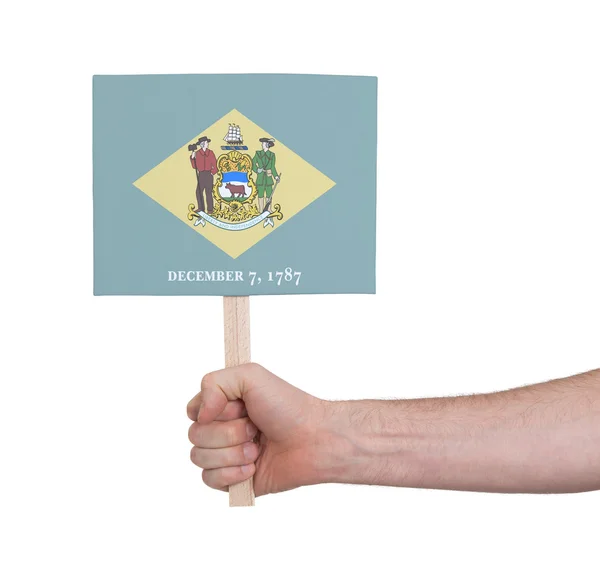 Ruka drží malé karty - Flag of Delaware — Stock fotografie